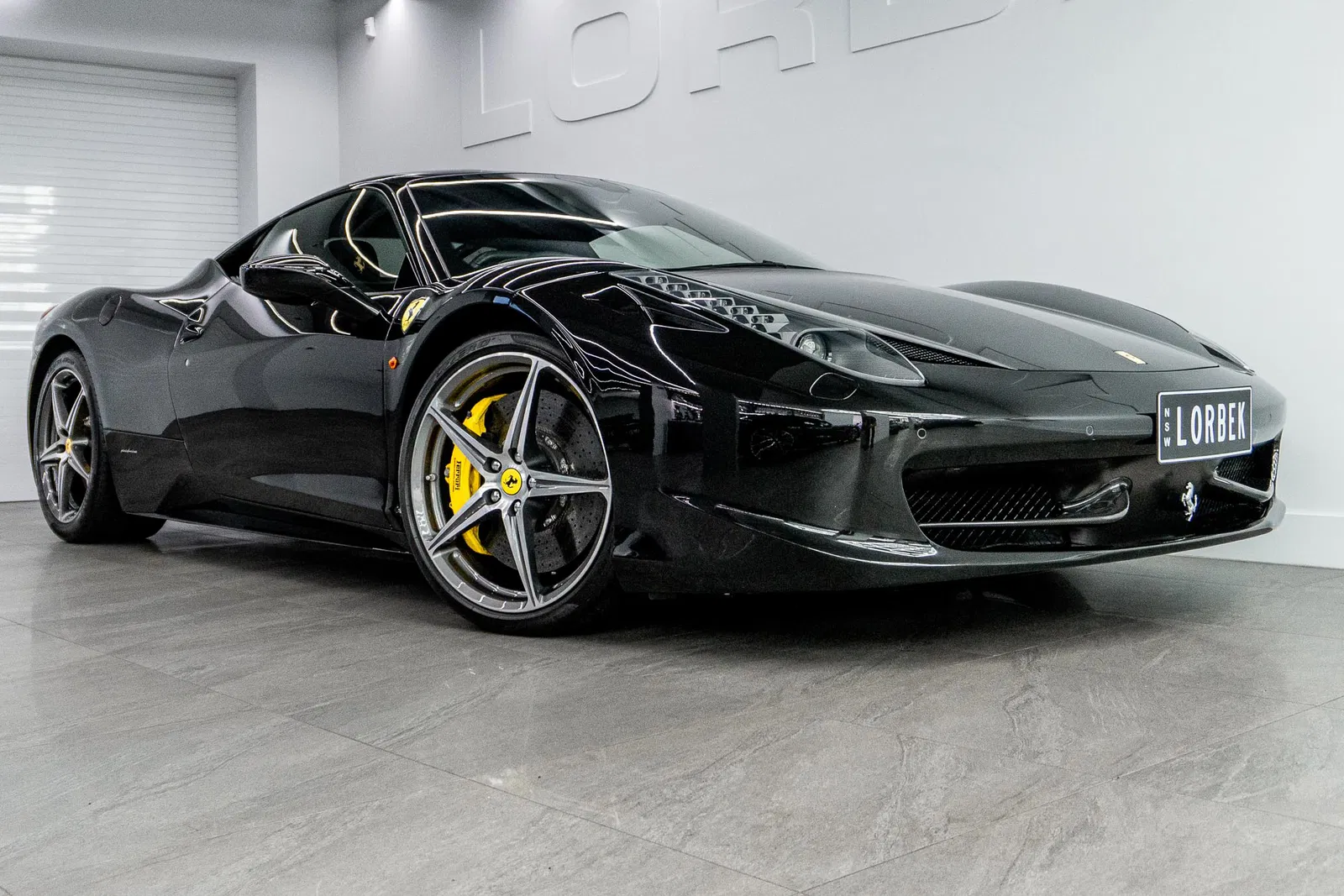 2011 Black Ferrari 458 with yellow accents